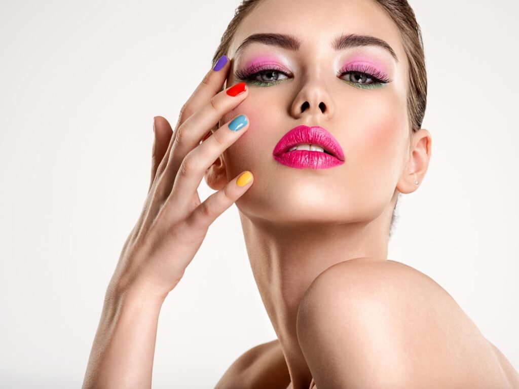 Beautiful fashion woman with a colored nails.